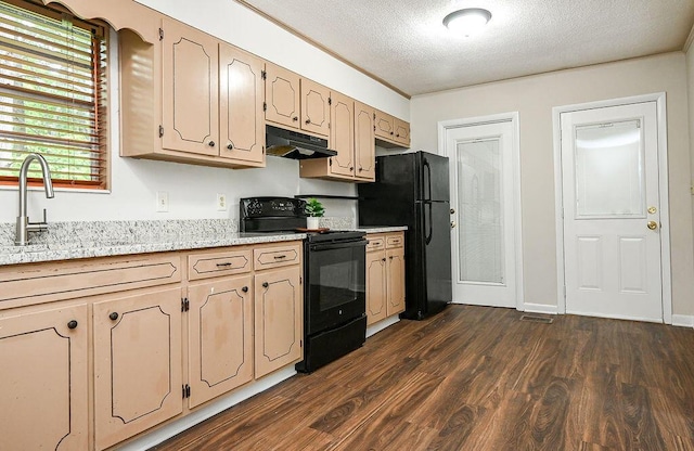 1132 Eldredge Cir NW, Cleveland, TN 37312 - kitchen featuring black appliances, under cabinet range hood, dark wood-type flooring, a textured ceiling, and light stone counters