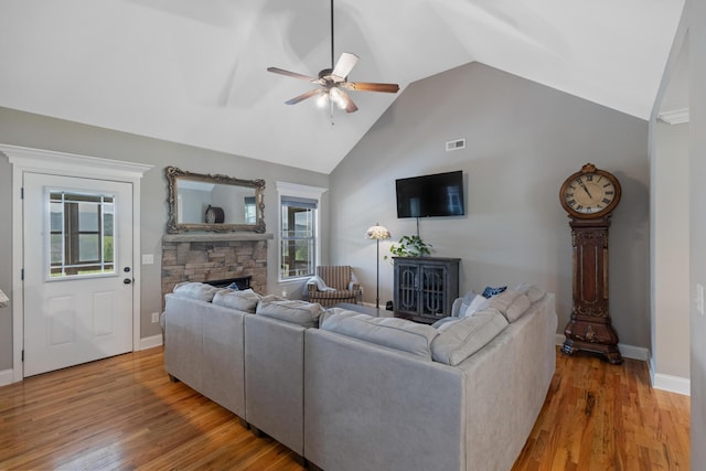7083 Blue Springs Rd SE, Cleveland, TN 37311 - living area with a fireplace, ceiling fan, healthy amount of natural light, wood finished floors, and high vaulted ceiling
