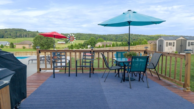 7083 Blue Springs Rd SE, Cleveland, TN 37311 - deck featuring a storage shed and outdoor dining area