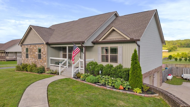 7083 Blue Springs Rd SE, Cleveland, TN 37311 - view of front of home with a shingled roof, an attached garage, concrete driveway, a porch, and stone siding