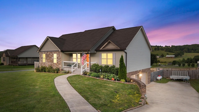 7083 Blue Springs Rd SE, Cleveland, TN 37311 - view of front of home with a porch, a garage, concrete driveway, stone siding, and roof with shingles