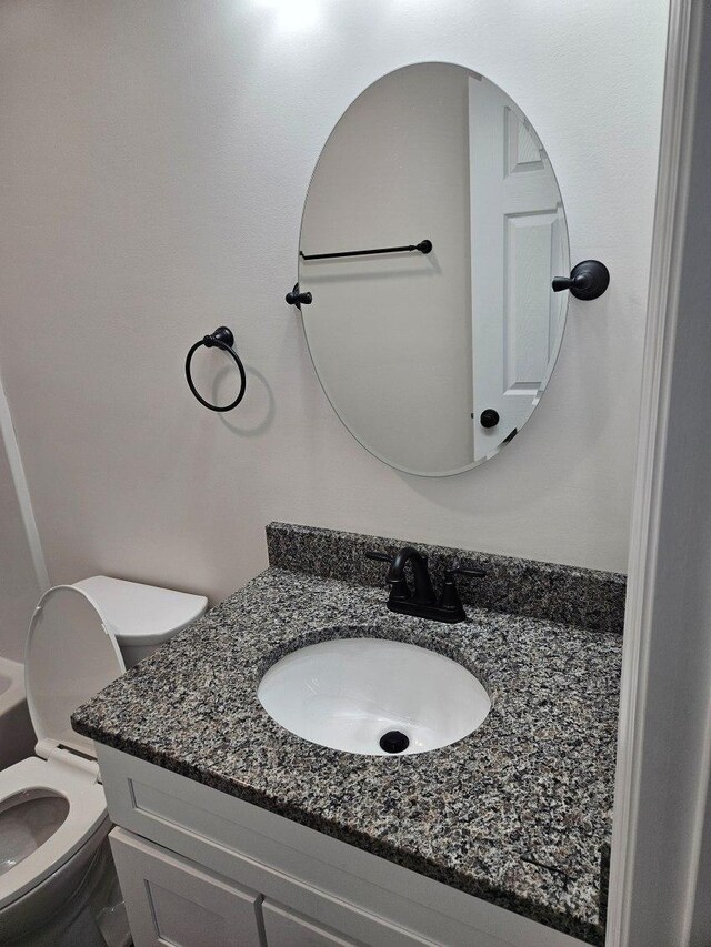 bathroom featuring tile patterned floors, vanity, and washtub / shower combination