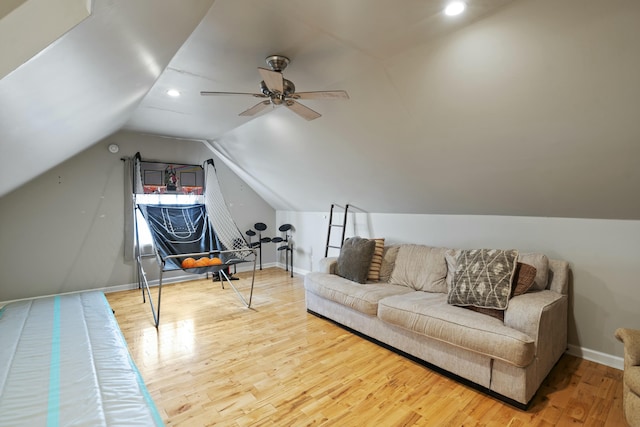 additional living space featuring a ceiling fan, baseboards, recessed lighting, wood finished floors, and lofted ceiling