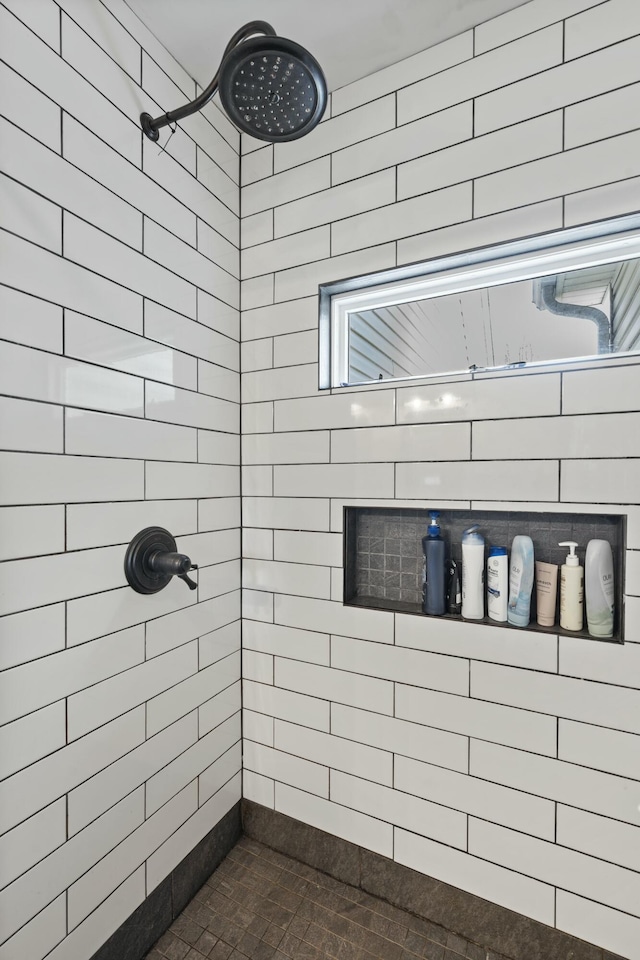 full bathroom with a tile shower