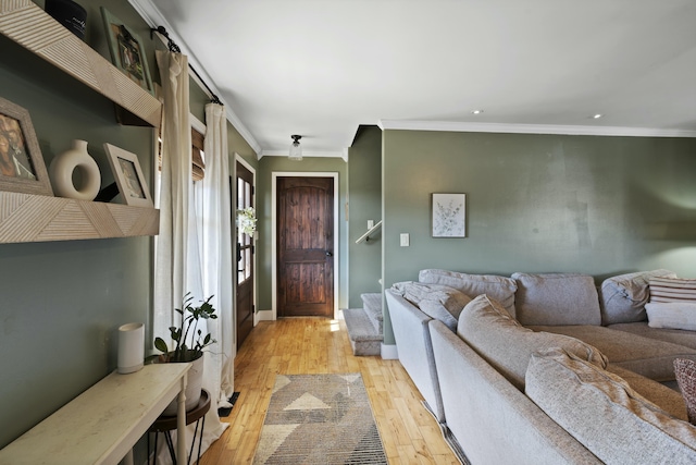 living room with recessed lighting, ornamental molding, and light wood finished floors