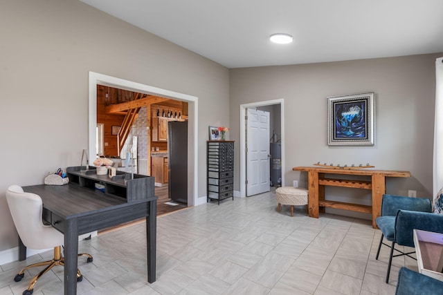 office area with electric water heater and lofted ceiling