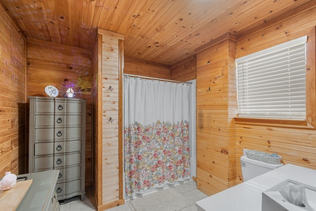 bathroom with wood walls, wood ceiling, and toilet