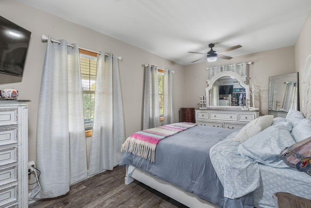 bedroom featuring ceiling fan and dark wood-type flooring