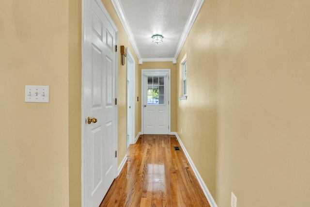 1454 Benjamin Cir NW, Cleveland, TN 37312 - entryway with light wood-style flooring, ornamental molding, baseboards, and a textured ceiling