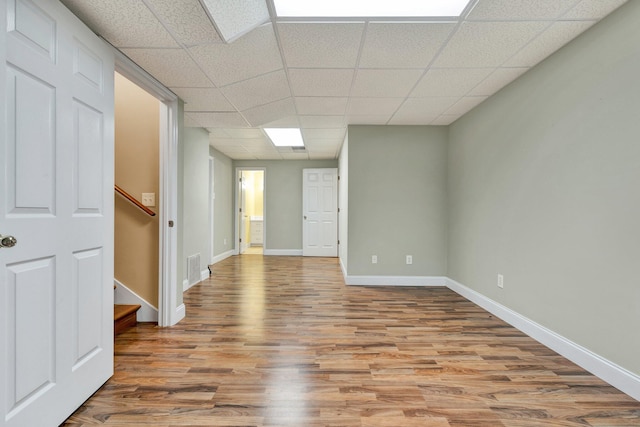 1454 Benjamin Cir NW, Cleveland, TN 37312 - spare room with a drop ceiling, wood finished floors, baseboards, and stairs