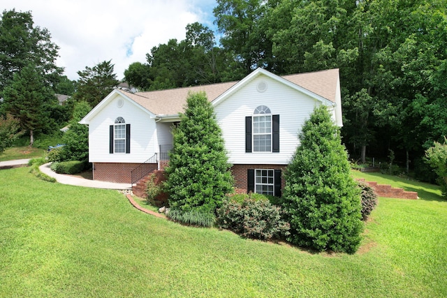 1454 Benjamin Cir NW, Cleveland, TN 37312 - view of front of property featuring a front yard, brick siding, roof with shingles, and stairs