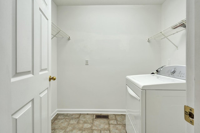1454 Benjamin Cir NW, Cleveland, TN 37312 - laundry area with baseboards, washing machine and clothes dryer, and light stone finish flooring