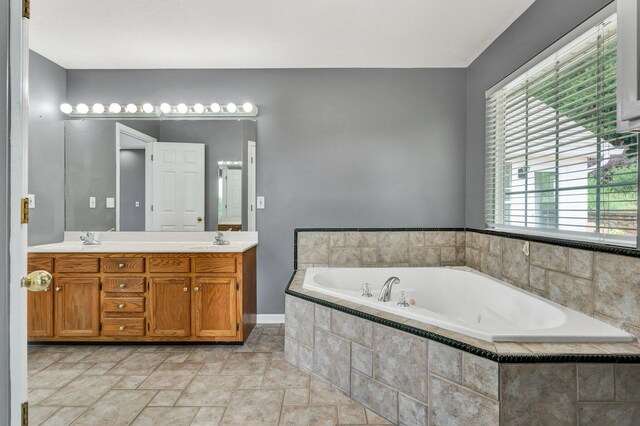 1454 Benjamin Cir NW, Cleveland, TN 37312 - full bath with a garden tub, double vanity, stone finish flooring, and baseboards