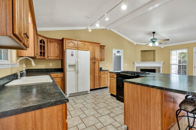 1454 Benjamin Cir NW, Cleveland, TN 37312 - kitchen with white refrigerator with ice dispenser, black gas range, a sink, lofted ceiling, and a ceiling fan