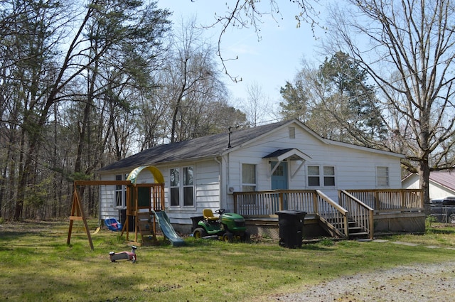 183 Bettis Ave SW, Cleveland, TN 37311 - view of front of home featuring a playground, a front yard, and a deck