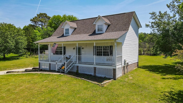 view of front of house featuring covered porch and a front yard