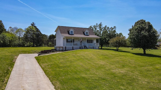 cape cod house featuring a porch and a front yard