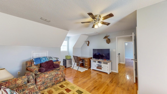 LOT1 Cabrera Dr SE, Cleveland, TN 37323 - living area with light wood-style floors, a ceiling fan, vaulted ceiling, and a textured ceiling