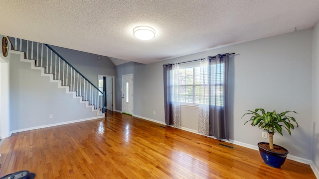 LOT1 Cabrera Dr SE, Cleveland, TN 37323 - foyer entrance featuring healthy amount of natural light, stairs, light wood-type flooring, a textured ceiling, and vaulted ceiling