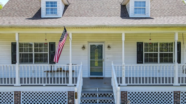 doorway to property with covered porch