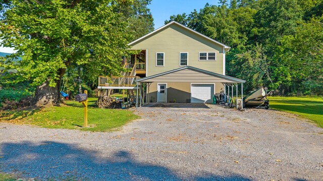 101 Riverview Ln, Reliance, TN 37369 - view of front of property with an attached garage, gravel driveway, and a front lawn