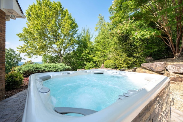 view of pool featuring a hot tub