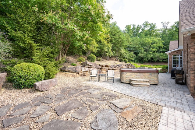 view of patio with a hot tub