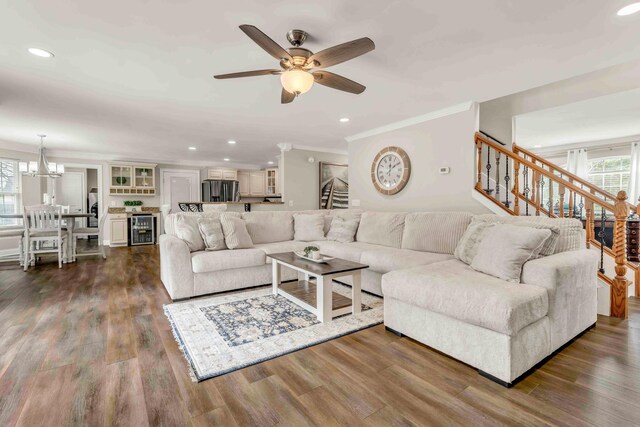 1732 Brookwood Dr NE, Cleveland, TN 37323 - living room featuring stairs, ornamental molding, plenty of natural light, and ceiling fan with notable chandelier