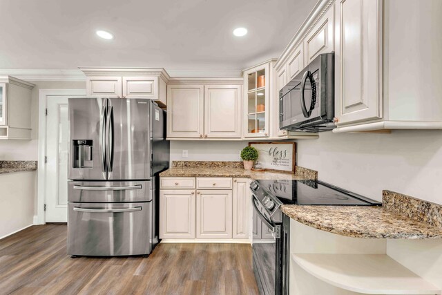 1732 Brookwood Dr NE, Cleveland, TN 37323 - kitchen featuring recessed lighting, light wood-style flooring, glass insert cabinets, light stone countertops, and appliances with stainless steel finishes