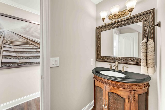 1732 Brookwood Dr NE, Cleveland, TN 37323 - bathroom featuring wood finished floors, baseboards, and vanity