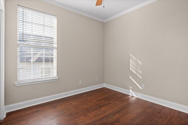 unfurnished room featuring dark wood-type flooring, ceiling fan, baseboards, and ornamental molding