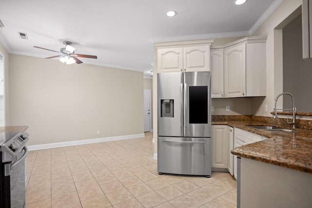 kitchen featuring visible vents, ornamental molding, a ceiling fan, a sink, and stainless steel fridge with ice dispenser