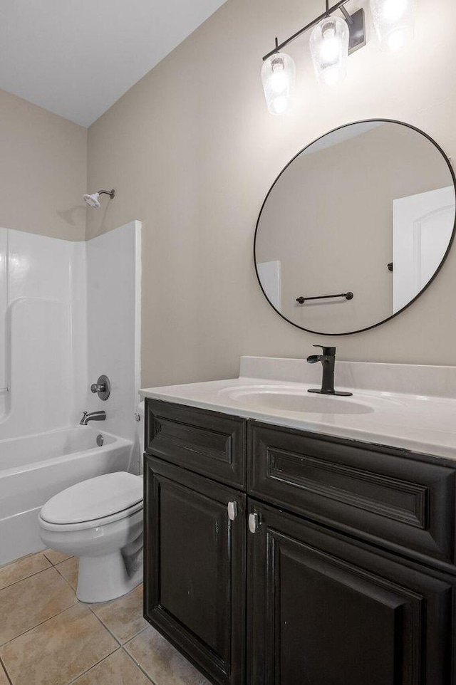 full bath with tile patterned flooring, bathtub / shower combination, vanity, and toilet