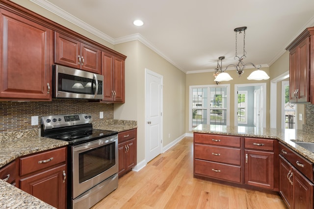 kitchen with tasteful backsplash, light stone counters, light wood finished floors, appliances with stainless steel finishes, and decorative light fixtures