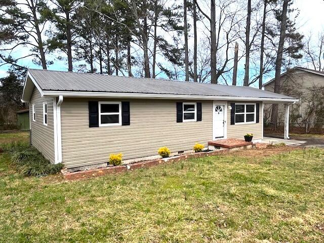 view of front of property with a carport