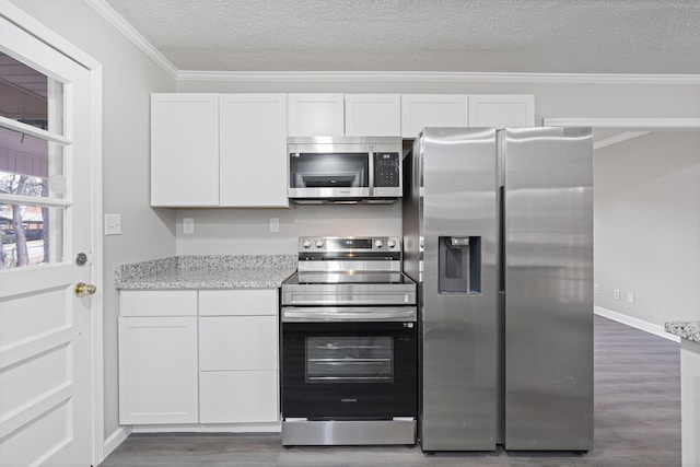 kitchen with white cabinetry, crown molding, a textured ceiling, dark hardwood / wood-style floors, and stainless steel appliances