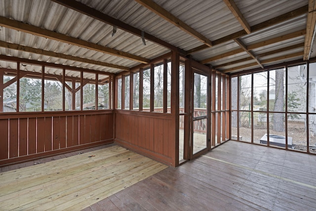 unfurnished sunroom featuring plenty of natural light