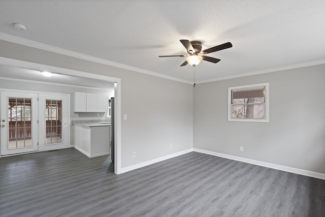 unfurnished living room with dark hardwood / wood-style flooring, crown molding, and a textured ceiling