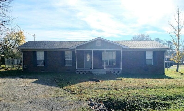 ranch-style home with a front lawn and a sunroom