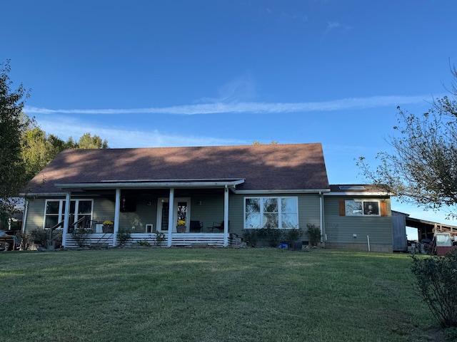 ranch-style home with a porch and a front lawn