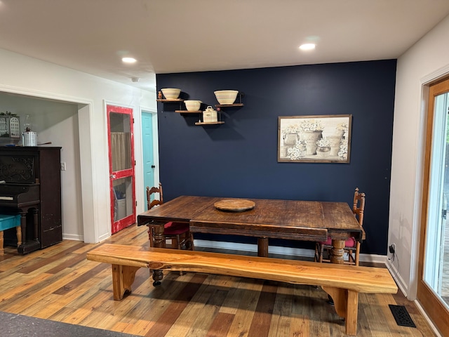 dining room featuring wood-type flooring