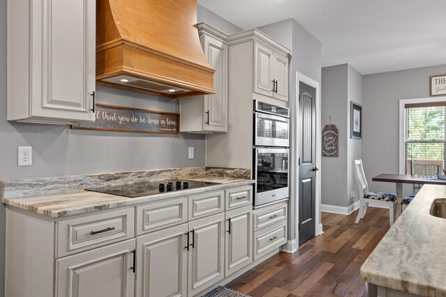 kitchen with white cabinets, dark hardwood / wood-style floors, custom range hood, and black electric cooktop