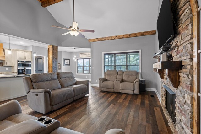 living room featuring hardwood / wood-style floors, ceiling fan, a fireplace, and high vaulted ceiling