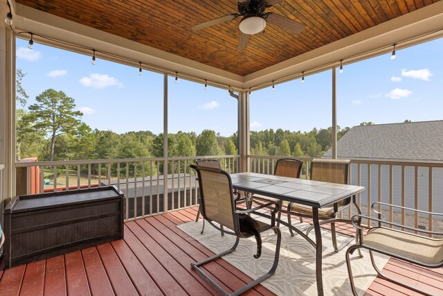 wooden deck featuring ceiling fan