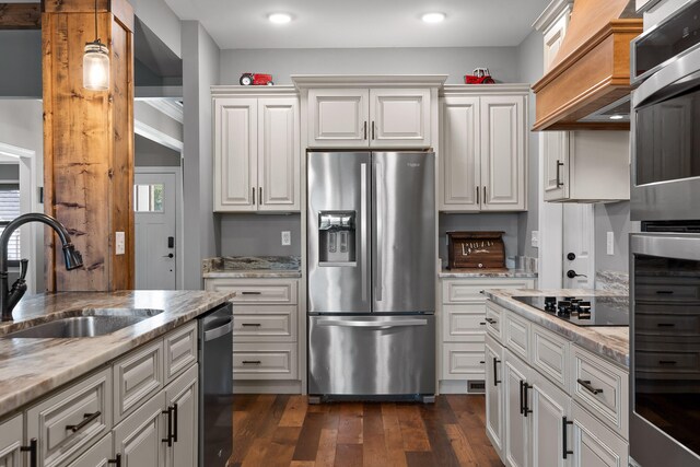 kitchen featuring dark hardwood / wood-style flooring, sink, white cabinets, and stainless steel appliances