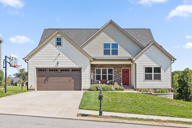 craftsman inspired home featuring a garage and a front lawn