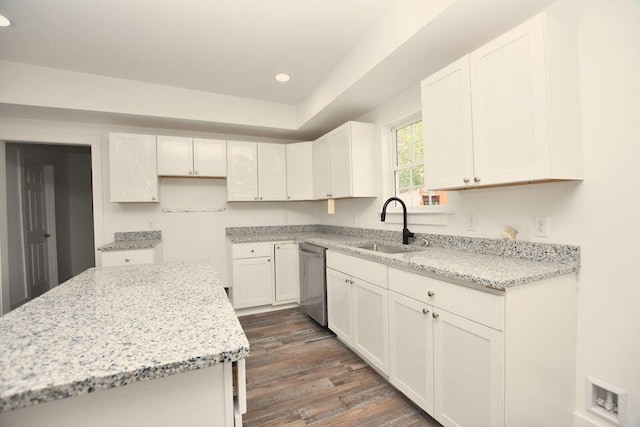 1903 Sharp St, Chattanooga, TN 37404 - kitchen featuring dishwasher, a sink, dark wood-style floors, white cabinetry, and light stone countertops