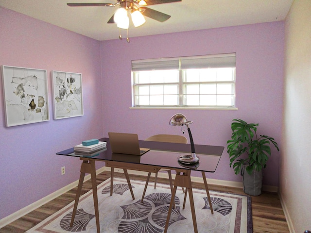 home office featuring hardwood / wood-style flooring and ceiling fan