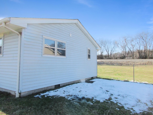 snow covered property with a yard