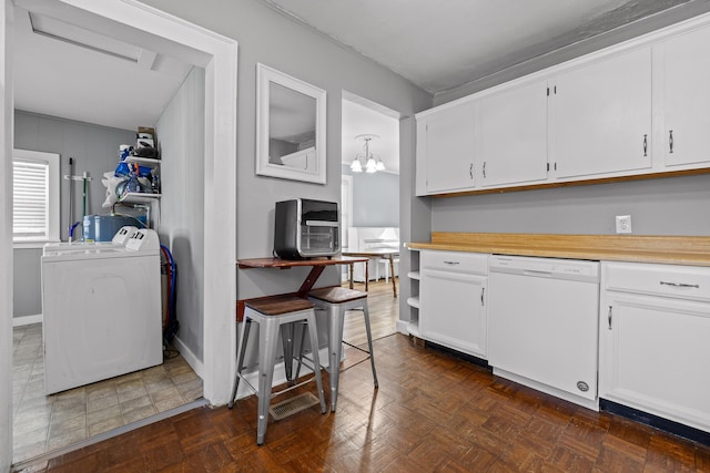 kitchen with white cabinets, washer / clothes dryer, and white dishwasher